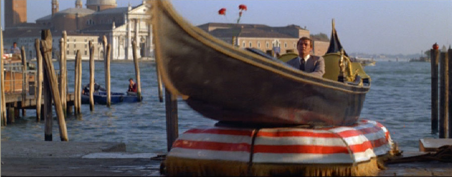 Roger Moore changed costumes five times before he managed to come up md car from the water at St Markusplts in Venice.