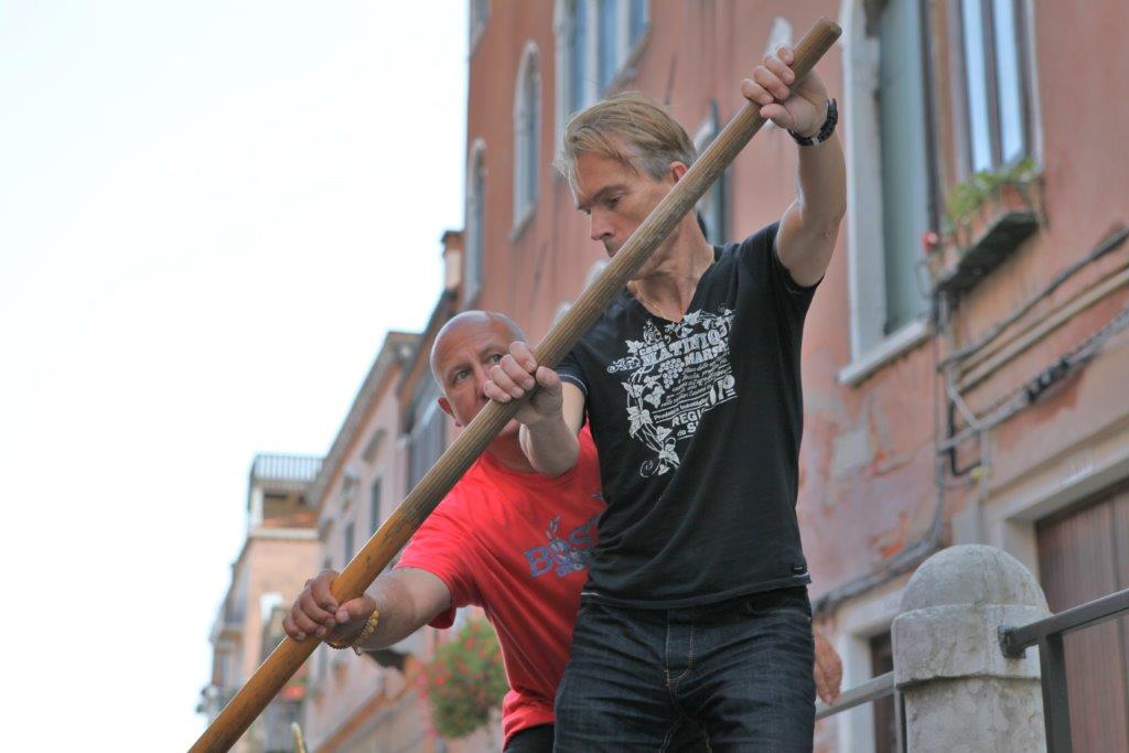 Gondolier Ettore ltry to learn Mr James Bond how to do...